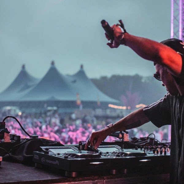 DJ at event. Photo by Arthur Edelmans on Unsplash
