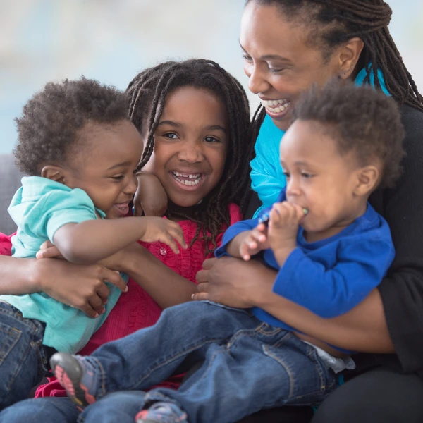 image of a happy mother with her children